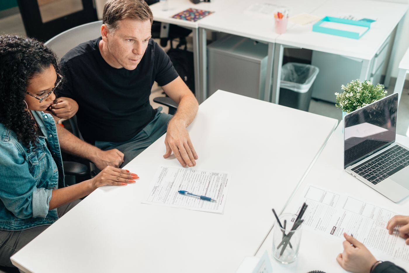 Couple reviewing documents during a consultation
