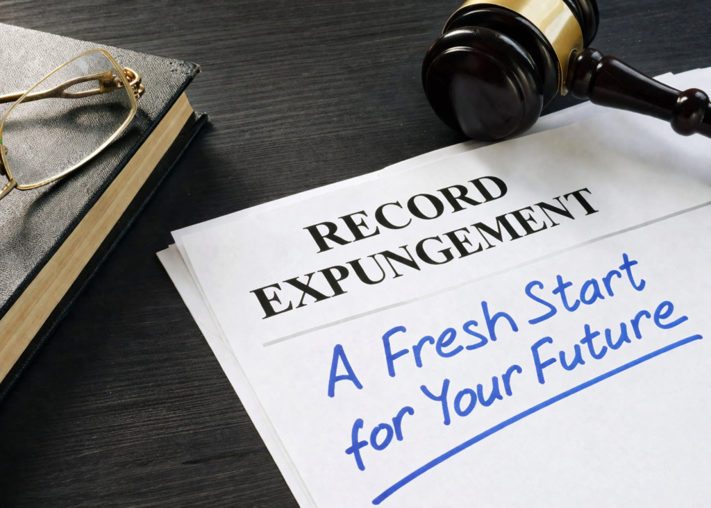 Record expungement document beside a gavel and book